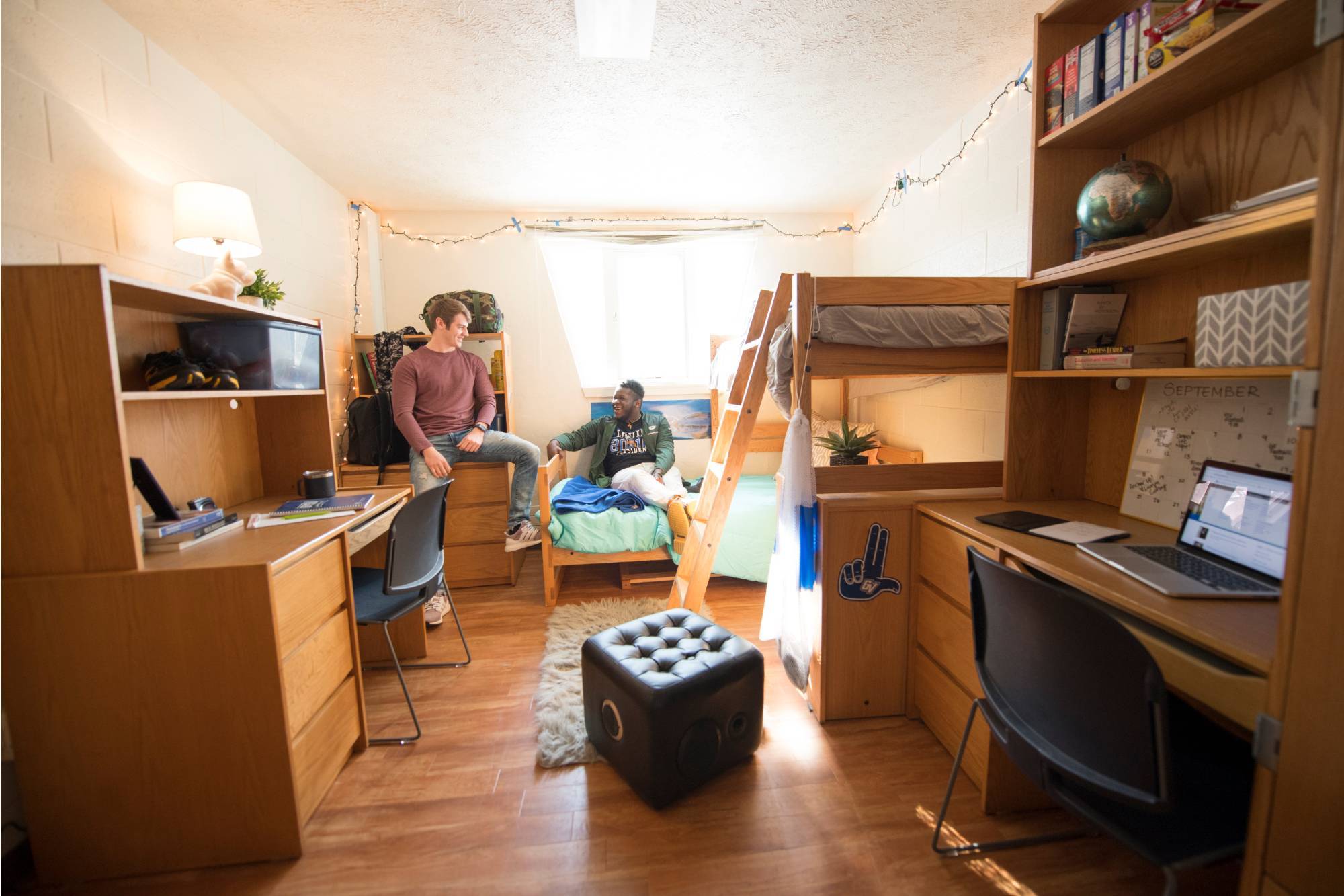 GVSU traditional-style student residents talking in their room.